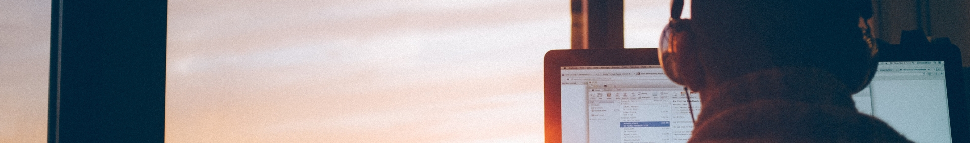 Computer screen with person with headphones