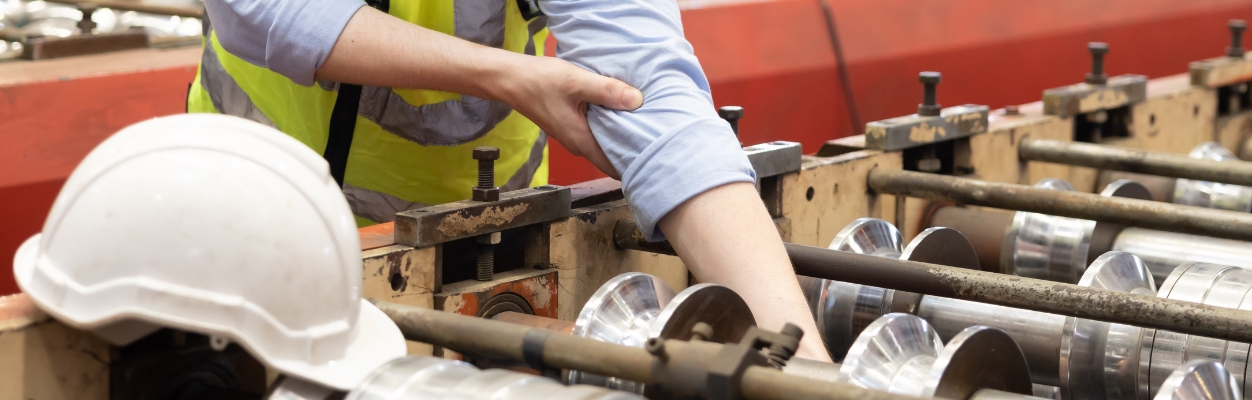 Person with arm in machinery